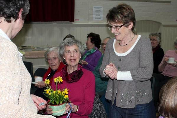 Merrill - Mary present Sheila with her winning raffle prize.jpg